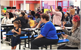 Parent and students watching a school performance